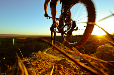 Aaron DenBleyker flying down Joe's ridge on the bike.  Fruita, Colorado.